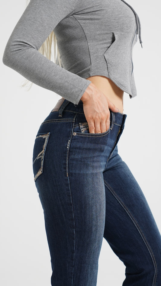 Side view of a woman with pear shape wearing skinny jeans
